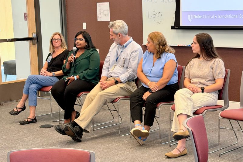 A group of five people on a panel