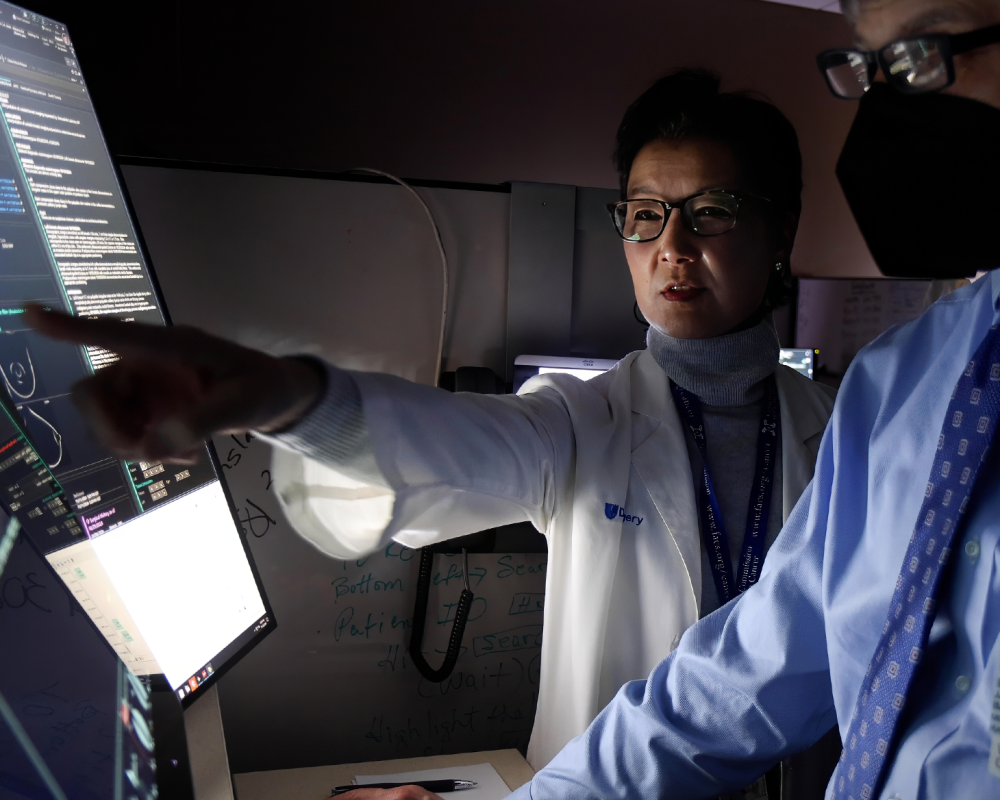 doctors looking at results on a screen in clinic
