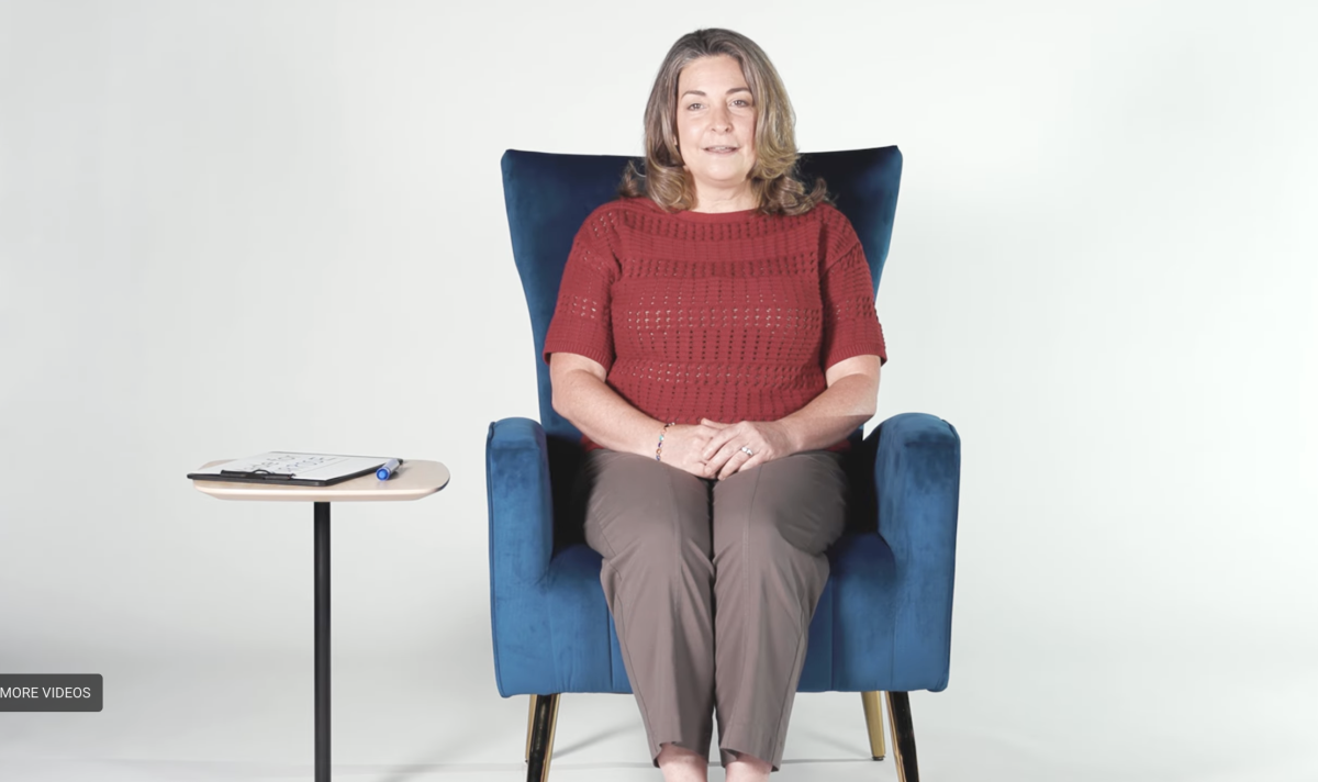 Heather Whitson sitting in a blue chair