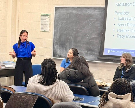 Tracy Truong, speaking to a group in a classroom