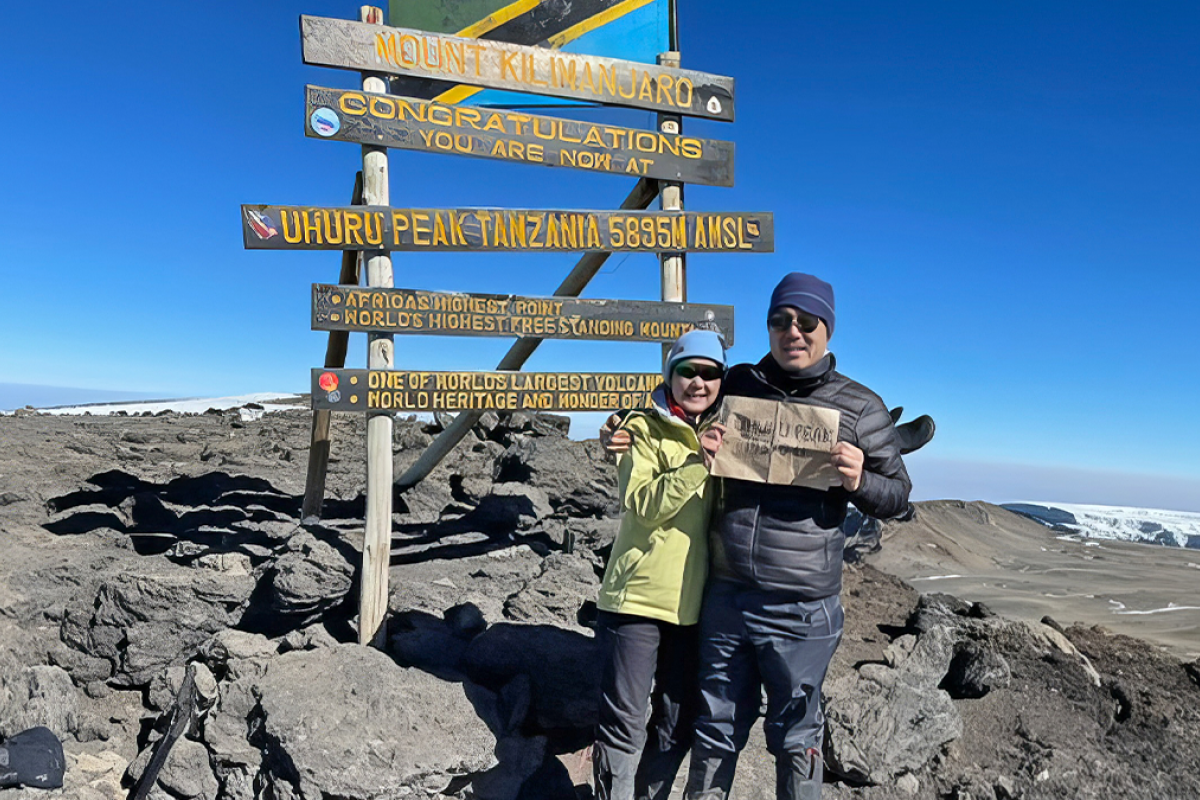 Shelley Hwang and husband on top of Mt. Kilimanjaro