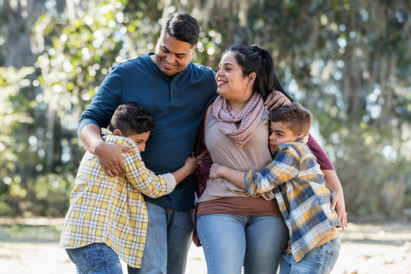 Family walking together outdoors.