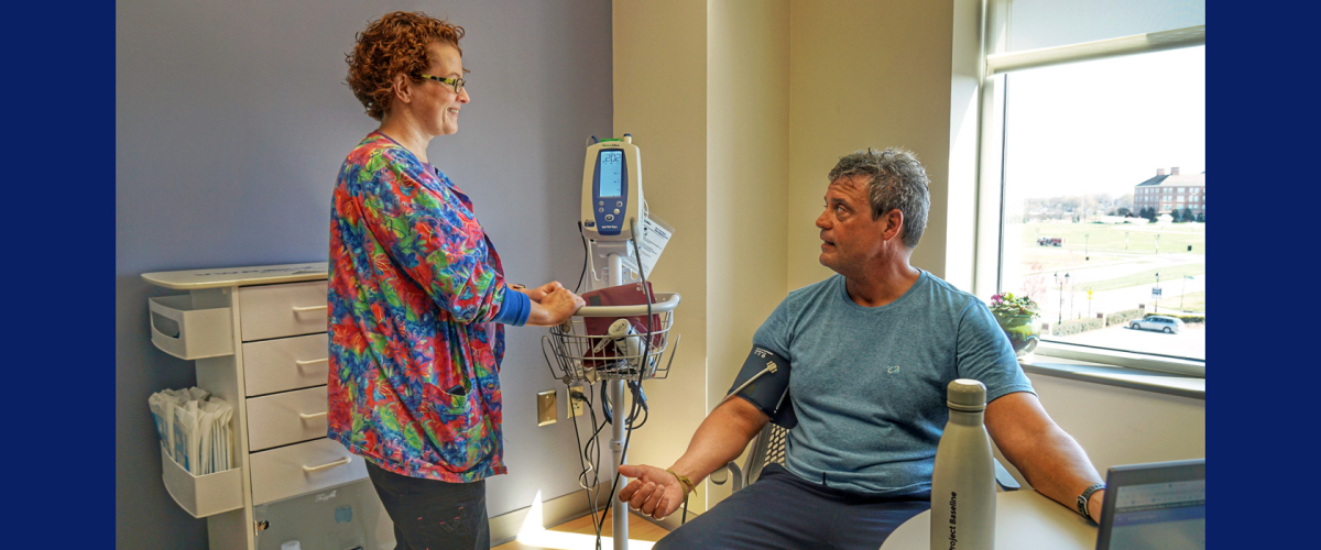 Clinician and study participant in exam room