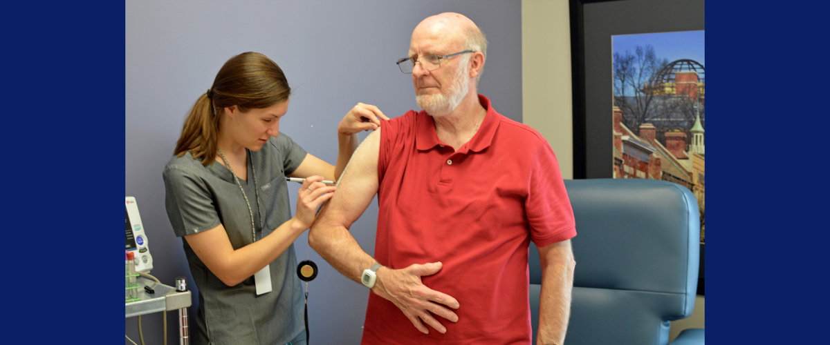 Clinician and study participant in exam room