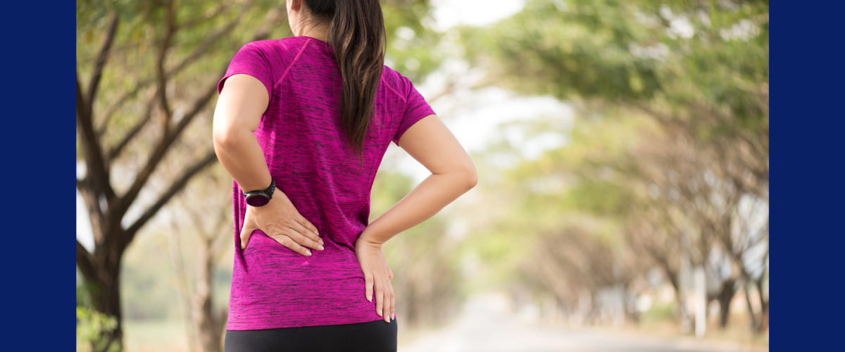 Photo of woman outdoors experiencing low back pain