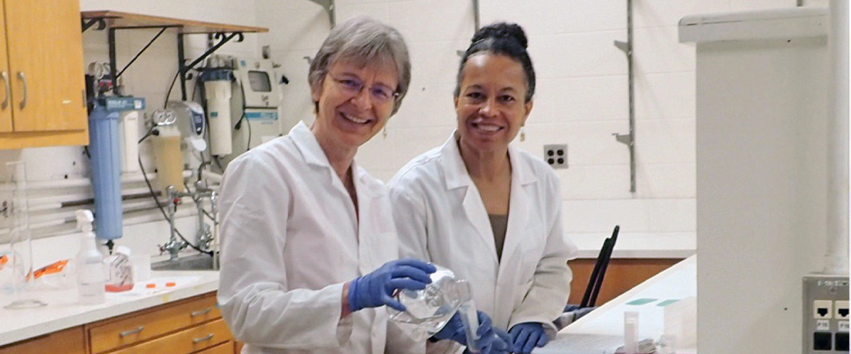 Friederike L. Jayes, PhD and Darlene Taylor, PhD at a bench in the lab