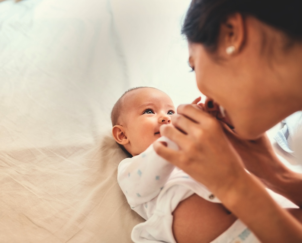 baby and mother looking at each other
