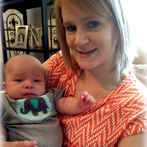 Bennett holding her baby