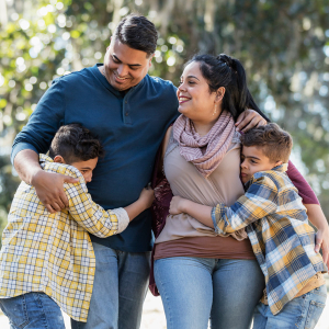 Family walking together outdoors.