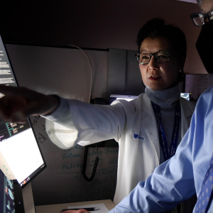 doctors looking at results on a screen in clinic