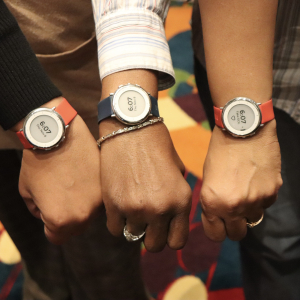 The outstretched arms of three Duke participants in the Project Baseline Health Study, showing the investigational study watch on each wrist.
