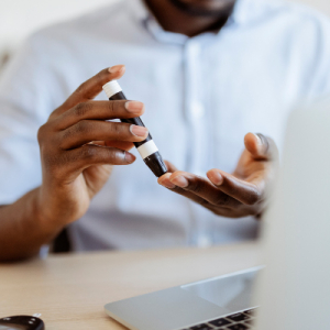 Stock photo of a person checking their blood glucose levels